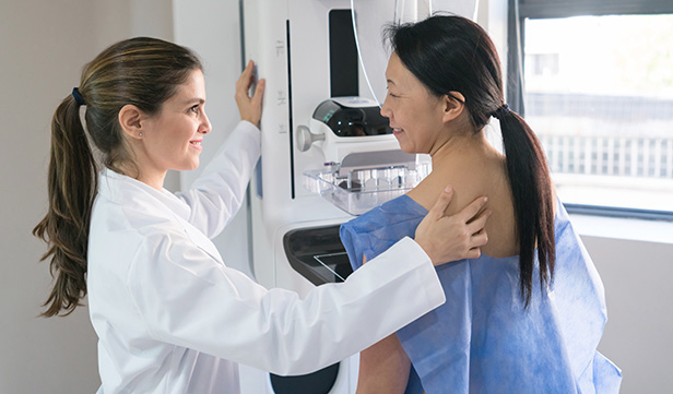 Woman receiving breast cancer screening