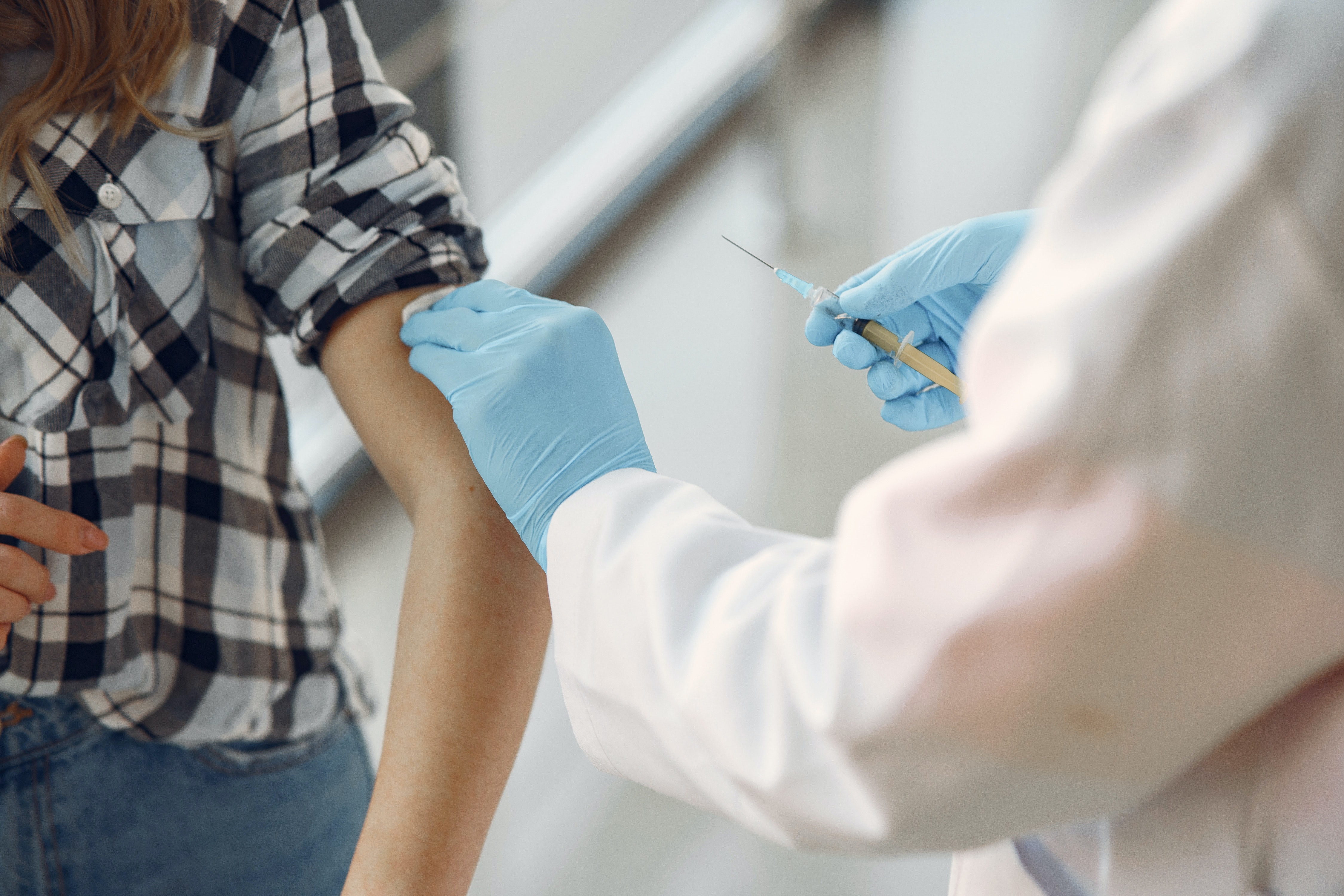 Person receiving a vaccine